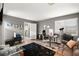 Spacious home office featuring light wood floors, a black rug, and a large window at 2250 Tedesca Dr, Henderson, NV 89052