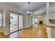 Bright dining area with wood floors, sliding doors to the patio, and mirrored wall at 2251 Wigwam Pkwy # 824, Henderson, NV 89074
