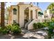 Condo building exterior with tan stucco, green awnings, and desert landscaping at 2251 Wigwam Pkwy # 824, Henderson, NV 89074