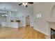 A bright living room shows the wood floors, fireplace, and an open view to the kitchen at 2251 Wigwam Pkwy # 824, Henderson, NV 89074