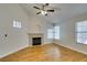 Bright living room with fireplace, ceiling fan, and hardwood floors at 2251 Wigwam Pkwy # 824, Henderson, NV 89074
