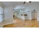 Bright open-concept living room featuring wood floors, large windows, fireplace and open kitchen at 2251 Wigwam Pkwy # 824, Henderson, NV 89074