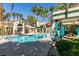 Relaxing pool area surrounded by palm trees and lounge chairs at 2251 Wigwam Pkwy # 824, Henderson, NV 89074