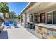 Inviting outdoor patio area with seating, grill, and access to the pool at 2285 Moresca Ave, Henderson, NV 89052