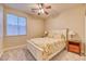 Bright bedroom with natural light, showcasing a comfortable bed and matching nightstands at 2285 Moresca Ave, Henderson, NV 89052