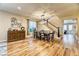 Dining room with hardwood floors, stylish decor, and staircase access at 2285 Moresca Ave, Henderson, NV 89052