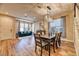 Open dining and living area featuring hardwood floors and a decorative chandelier at 2285 Moresca Ave, Henderson, NV 89052