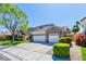 Charming home with a three-car garage, well-manicured landscaping, and a spacious driveway at 2285 Moresca Ave, Henderson, NV 89052