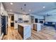 Bright kitchen with white cabinets, stainless steel appliances, and island seating at 2285 Moresca Ave, Henderson, NV 89052