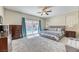 Bright main bedroom with sliding glass doors to the pool, carpet and modern furnishings at 2285 Moresca Ave, Henderson, NV 89052