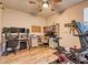Functional home office with a desk, Peloton bike, and ample natural light at 2285 Moresca Ave, Henderson, NV 89052