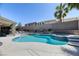 Beautiful backyard swimming pool with a spa and lush landscaping at 2285 Moresca Ave, Henderson, NV 89052