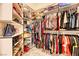 Organized walk-in closet featuring shelving and hanging racks for ample storage space at 2285 Moresca Ave, Henderson, NV 89052