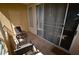 Relax on this private balcony featuring tile floors and seating, perfect for enjoying the outdoors at 230 E Flamingo Rd # 129, Las Vegas, NV 89169