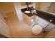 Modern bathroom with granite countertops, a large mirror, and clean tile flooring at 230 E Flamingo Rd # 129, Las Vegas, NV 89169