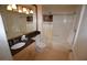 Well-maintained bathroom with granite countertops, a tub and shower combination, and ample storage space at 230 E Flamingo Rd # 129, Las Vegas, NV 89169