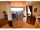 Modern kitchen showcasing stainless steel refrigerator and adjacent dining area at 230 E Flamingo Rd # 129, Las Vegas, NV 89169