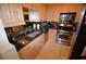 Modern kitchen boasting stainless steel appliances, granite countertops, and ample cabinet space at 230 E Flamingo Rd # 129, Las Vegas, NV 89169