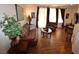 Inviting living room featuring wood floors, comfortable leather seating, and light from the balcony at 230 E Flamingo Rd # 129, Las Vegas, NV 89169