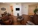 Open living room showcasing hardwood floors, a comfortable seating arrangement, and elegant decor at 230 E Flamingo Rd # 129, Las Vegas, NV 89169