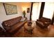 Comfortable living room featuring hardwood floors, a cozy couch, and stylish decor at 230 E Flamingo Rd # 129, Las Vegas, NV 89169