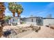 A view of the yard, with a shed and drought-tolerant landscaping at 237 Cervantes St, Las Vegas, NV 89101