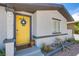 Close up of the front entrance showcasing the yellow door and decorative wreath at 237 Cervantes St, Las Vegas, NV 89101