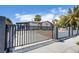 View of the front of the property highlighting the gated front yard for security and privacy at 237 Cervantes St, Las Vegas, NV 89101