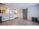 Open floor plan featuring new laminate flooring and access to the kitchen area at 237 Cervantes St, Las Vegas, NV 89101