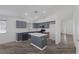 Modern kitchen with gray cabinets, an island, and stainless steel appliances at 2410 Morocco Ave, North Las Vegas, NV 89031