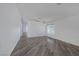Spacious living area with sleek, modern floors, neutral paint, and bright lighting at 2410 Morocco Ave, North Las Vegas, NV 89031