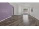 Bright living room features wood-look floors and access to the backyard at 2410 Morocco Ave, North Las Vegas, NV 89031