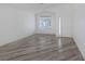 Bright living room showcasing modern wood-look flooring and ample natural light at 2410 Morocco Ave, North Las Vegas, NV 89031