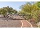 Scenic walking path through lush landscaping provides a peaceful retreat for exercise and relaxation at 2410 Morocco Ave, North Las Vegas, NV 89031