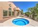 Beautiful backyard with spa, patio, and lush landscaping at 27 Via Paradiso St, Henderson, NV 89011