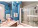 ' bathroom featuring vanity, bathtub with shower, and sea creature wall decals at 27 Via Paradiso St, Henderson, NV 89011