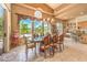 Beautiful dining room showcasing a large window, stylish light fixture, and access to the outdoor space at 27 Via Paradiso St, Henderson, NV 89011