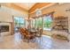 The formal dining room features a fireplace and access to an outdoor space with a hot tub at 27 Via Paradiso St, Henderson, NV 89011