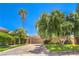Charming one-story home featuring a paver driveway and a two-car garage at 27 Via Paradiso St, Henderson, NV 89011