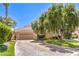 Charming one-story home featuring a paver driveway and a two-car garage at 27 Via Paradiso St, Henderson, NV 89011