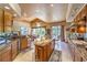 A chef's kitchen with modern appliances, granite countertops, and a seamless transition to the dining area at 27 Via Paradiso St, Henderson, NV 89011