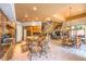 Open kitchen with granite counters, central island, breakfast bar, and seamless flow to dining and living areas at 27 Via Paradiso St, Henderson, NV 89011