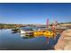 Lakefront view showcasing various boats and water activities with mountains in the background at 27 Via Paradiso St, Henderson, NV 89011
