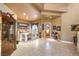 Spacious open-concept living room featuring tile floors and an abundance of natural light at 27 Via Paradiso St, Henderson, NV 89011