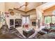 Cozy living room with a fireplace and comfortable seating at 27 Via Paradiso St, Henderson, NV 89011