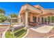 Covered patio with outdoor seating and pool table near a jacuzzi at 27 Via Paradiso St, Henderson, NV 89011