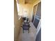 Cozy balcony area, complete with a table and two chairs, ideal for relaxation at 270 E Flamingo Rd # 319, Las Vegas, NV 89169