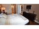 Well-lit bedroom with a television, dresser, and access to additional rooms in the home at 270 E Flamingo Rd # 319, Las Vegas, NV 89169