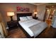 A cozy bedroom featuring a comfortable bed, modern lamps, and stylish decor at 270 E Flamingo Rd # 319, Las Vegas, NV 89169