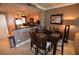 Cozy dining area with modern table, seating for six, and adjacent kitchen at 270 E Flamingo Rd # 319, Las Vegas, NV 89169